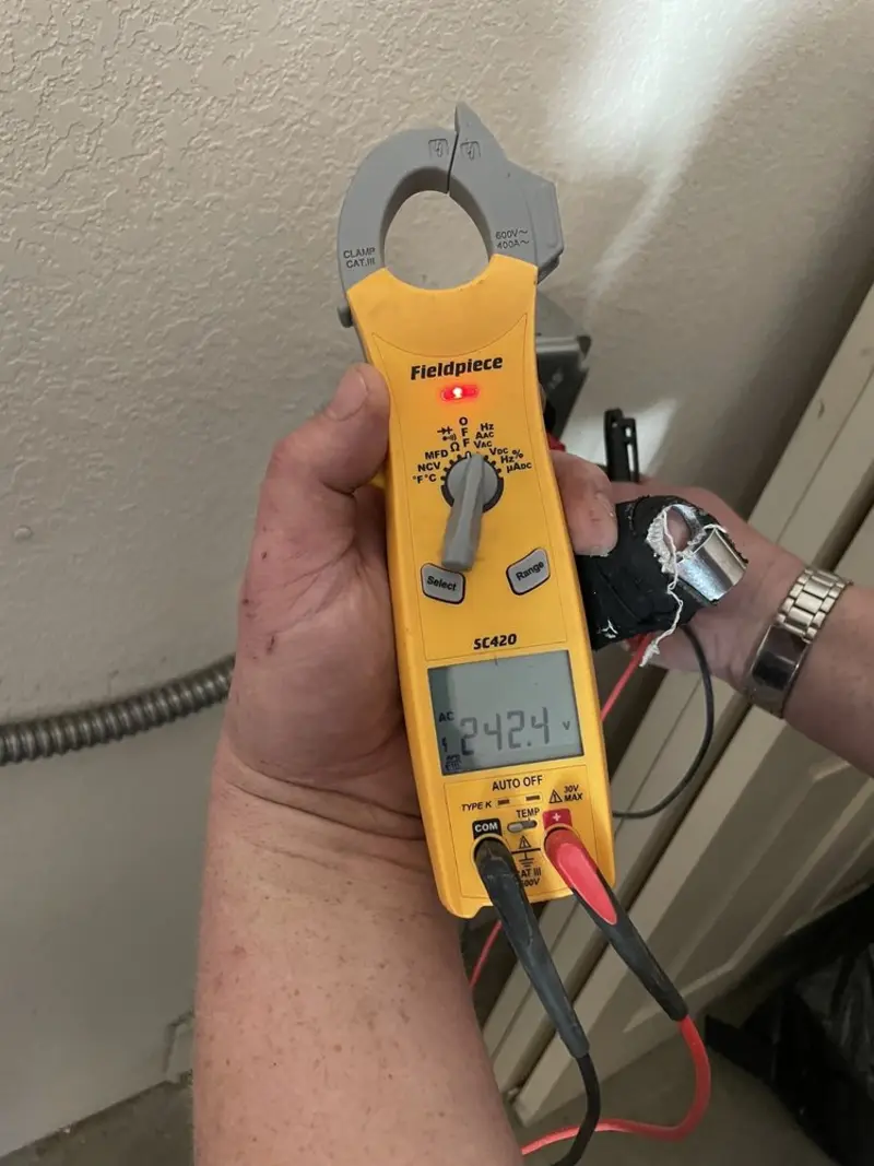 Voltage testing with clamp meter during Outlet Installation in Waseca